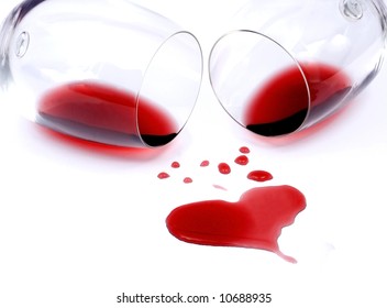 Red wine spilled from glasses forming heart shape - Powered by Shutterstock