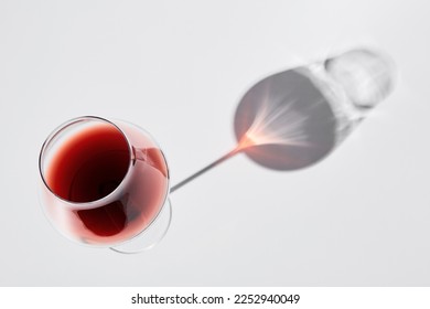 Red wine is in wineglass isolated on white background. - Powered by Shutterstock