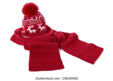 Red Winter Bobble Hat, Ski Or Knit Hat And Matching Scarf Isolated On A White Background