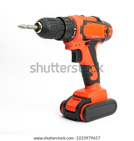 Red Wireless Drill Screwdriver with Black Decorative Design Elements with Lithium Battery on White Background