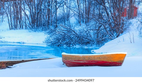 Red wooden boat covered with layers of snow - Beautiful winter landscape with snow covered red house - Tromso, Norway - Powered by Shutterstock