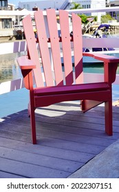 Red Wooden Chair At Dock 