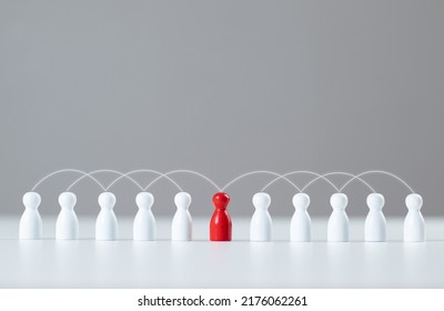 The red wooden figures stood out from the crowd. social media network A network that connects members. Communication, teamwork, community, society. Abstract concept with pieces of wood. Wooden puppet. - Shutterstock ID 2176062261