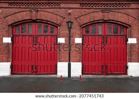 red wooden gates. Departure from the fire station