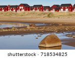 Red wooden houses near Marjaniemi beach, Hailuoto island. Finland. Travel