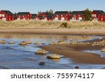 Red wooden houses near Marjaniemi beach, Hailuoto island. Finland. Travel