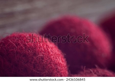 Red wool ball for needlework. Close up. Small depth of field (DOF)