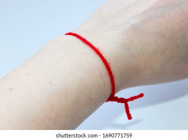 Red Woolen Thread On The Left Hand. Symbol Of Wealth And Well-being. Traditions.