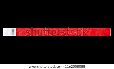 Red wristband for events, bracelet for concerts on black background