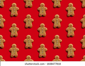 Red Xmas Background. Gingerbread Man Pattern. Holiday Decoration. Festive Ornament. Brown Cookies Collection Isolated On Bright Seamless Surface.