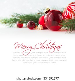 Red Xmas Ornaments On White Background. Merry Christmas Card. Winter Holiday Theme. Happy New Year. Space For Text.