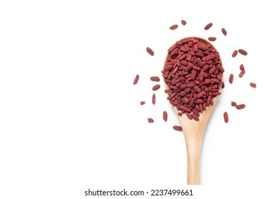 Red yeast rice in a wooden spoon. Chinese traditional food and medicine.