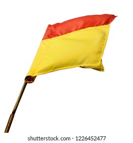 A Red And Yellow Beach Safety Flag Swaying In The Wind  Isolated On White