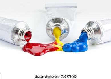 Red, Yellow And Blue Paint Flowing From Tubes, Blending Together