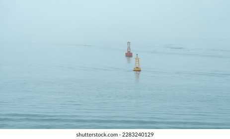 red and yellow buoy floating on water - Powered by Shutterstock
