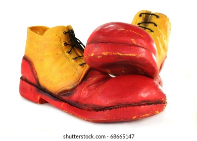 Red Yellow Clown Shoes On A White Background