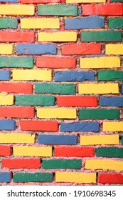 Red, Yellow, Green, Blue Coloured Brick Pattern.