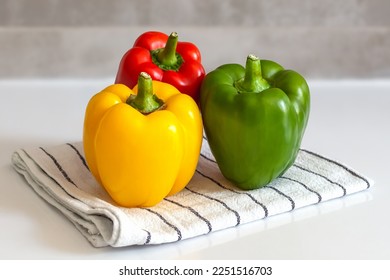 red yellow green sweet pepper on kitchen towel colorful paprika - Shutterstock ID 2251516703