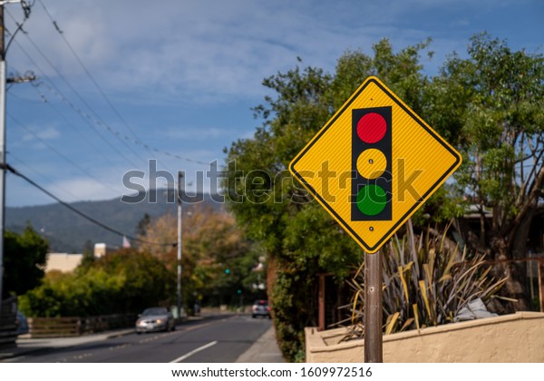 Red yellow green traffic light warning sign at the\
street side