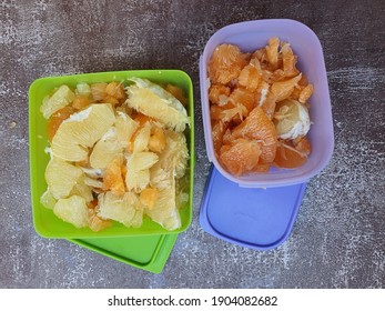 Red And Yellow Pomelo Shred In The Food Container Tupperware For Salad Preparation. Healthy And Rich Antioxidant. Selangor, Malaysia. January 2021