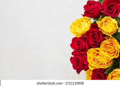 Red and yellow roses bouquet. Mothers day, Valentines Day, Birthday celebration concept. Copy space for text, top view