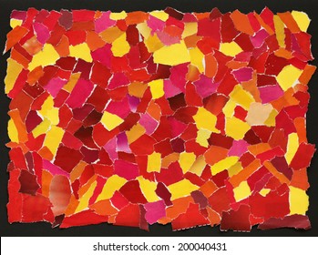 Red and yellow texture made from many pieces of torn paper 