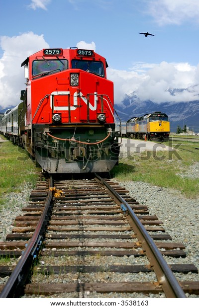 Red\
and yellow train engines at Jasper, Alberta,\
Canada