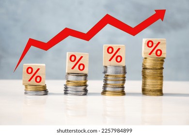 Red zigzag arrow going up concept of increase in high percentage on stack of coins