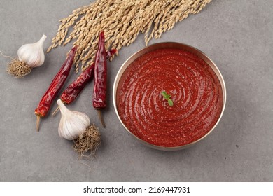 A red-colored spicy sauce made by mixing coarsely cooked rice, rice cake powder, or porridge made of rice or barley with soybean paste powder, red pepper powder, and salt. - Powered by Shutterstock