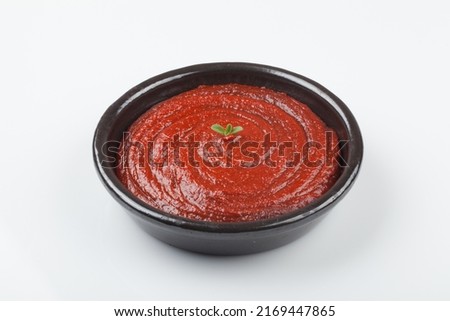 A red-colored spicy sauce made by mixing coarsely cooked rice, rice cake powder, or porridge made of rice or barley with soybean paste powder, red pepper powder, and salt.