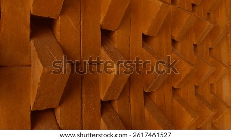 reddish brown brick building material arranged horizontally and diagonally as a decorative element