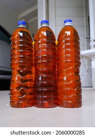 Reddish Orange Used Cooking Oil In Bottles