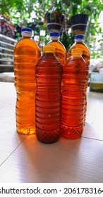 Reddish Orange Used Cooking Oil In Bottles