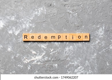 redemption word written on wood block. redemption text on cement table for your desing, concept. - Shutterstock ID 1749062207