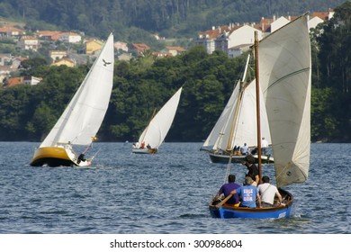 Redes Village, Galicia, Spain ; July 21, 2012 . Traditional sailing  boats racing regatta in Ares bay