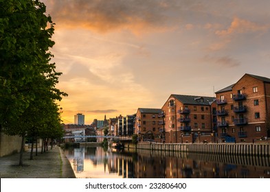 Redeveloped warehouses along the River Aire in Leeds at Sunset