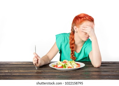 red-haired girl can't look at salad in studio