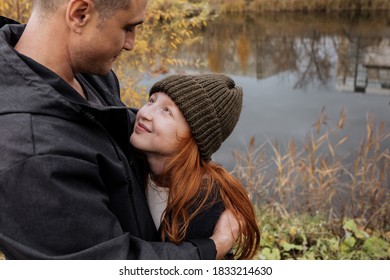 Red-haired Girl, Raising Her Head, Gently Looks At Dad.