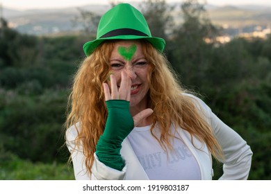 Red-haired Irish Woman In Green Cap On St. Patrick's Day 