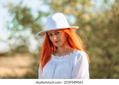 Red-haired lady wearing linen blouse, white hat, standing amidst village nature, surrounded by blooming flowers, lush greenery, rustic pathways, countryside scenery, exuding serene elegance and gracef - Powered by Shutterstock