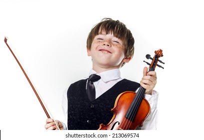 Red-haired preschooler boy with violin, music education