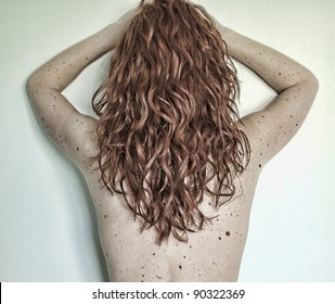 Red-haired Woman With Freckles Showing Her Back