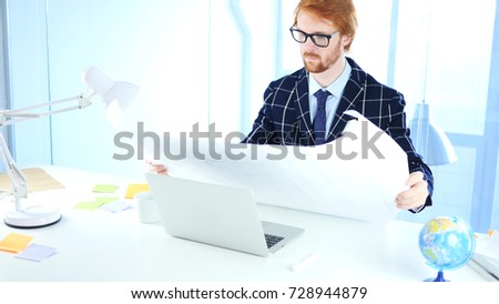 Redhead Architectural Engineer Working on Blueprint, Freelancer Desginer