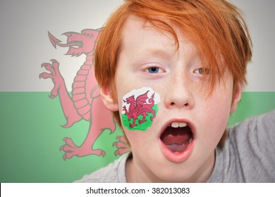 Redhead Fan Boy With Welsh Flag Painted On His Face. 