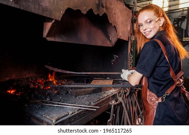 Redhead Ginger Woman Blacksmith Portrait In Workshop