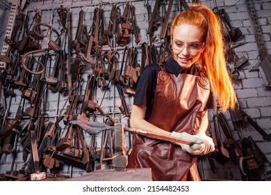 Redhead Ginger Woman Blacksmith Portrait In Workshop