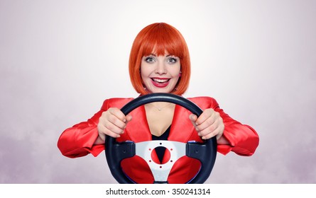 Redhead girl with car wheel and smoke - Shutterstock ID 350241314