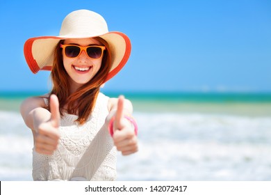 Redhead Girl On The Beach In Spring Time.