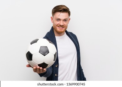 Redhead Man Holding A Soccer Ball