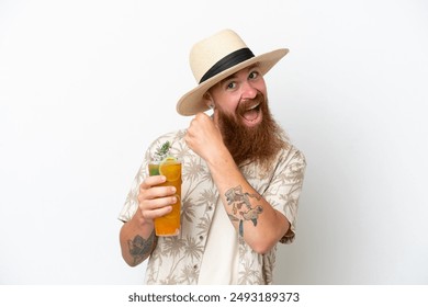 Redhead man with long beard drinking a cocktail on a beach isolated on white background celebrating a victory - Powered by Shutterstock